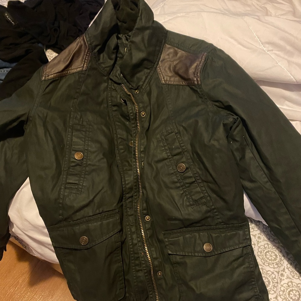 Green jacket with buttons and pockets
